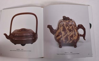 Charm of Dark-Red Pottery Teapots